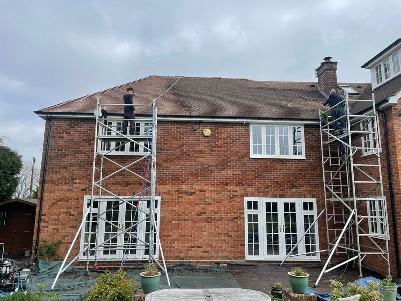 Roof cleaning carried out safely from scaffold towers by The Roof Moss Cleaners in Soham